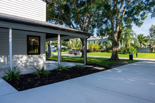 exterior space with a carport