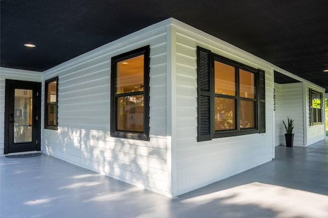 view of property exterior featuring a patio area