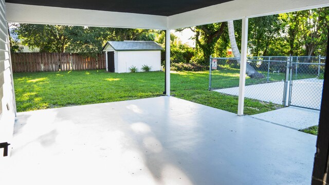 view of patio featuring a shed