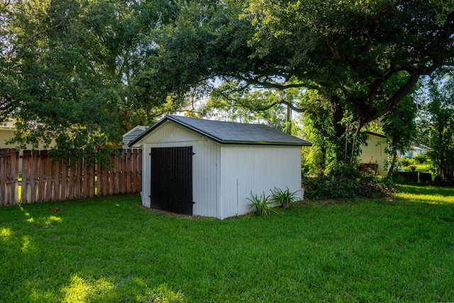 view of outdoor structure with a lawn