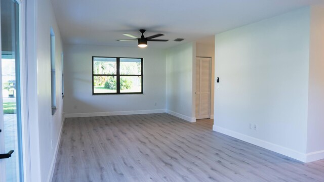 unfurnished room with light hardwood / wood-style flooring and ceiling fan