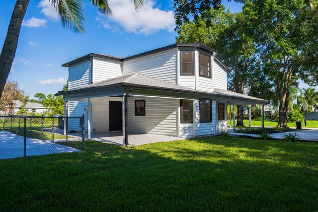 view of side of property with a lawn