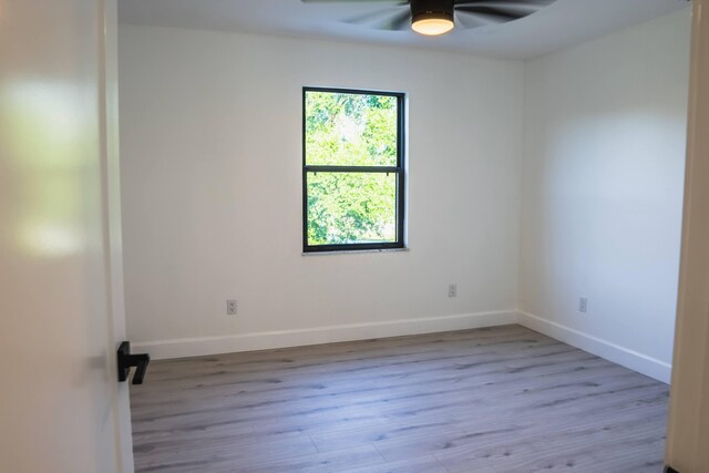 unfurnished room featuring light hardwood / wood-style floors and ceiling fan