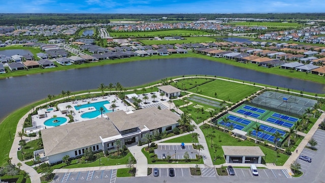 birds eye view of property with a water view