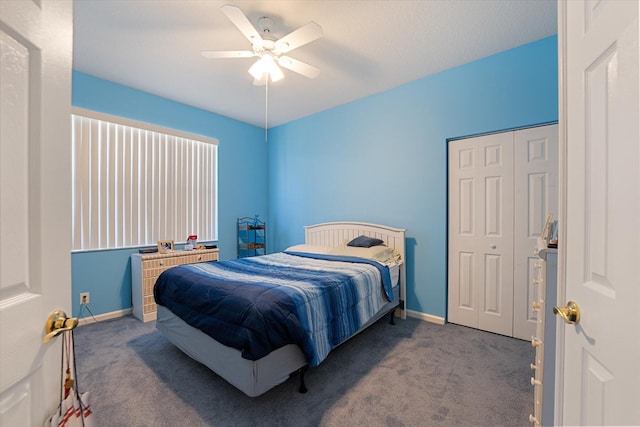 bedroom featuring carpet, ceiling fan, and a closet