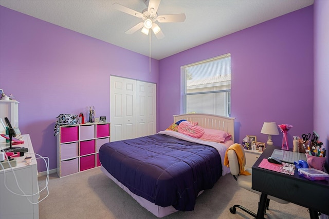 bedroom with light carpet, a closet, and ceiling fan