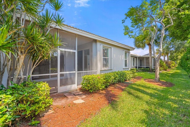 view of yard with a sunroom