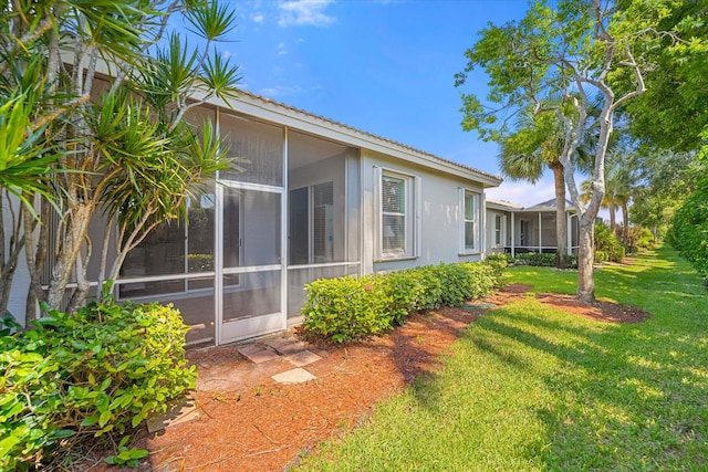 view of yard featuring a sunroom