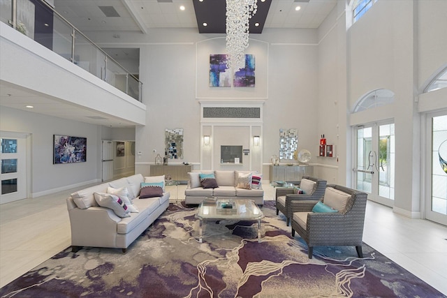 living room with a high ceiling, tile patterned flooring, and french doors