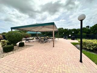 view of pool featuring an in ground hot tub and a patio