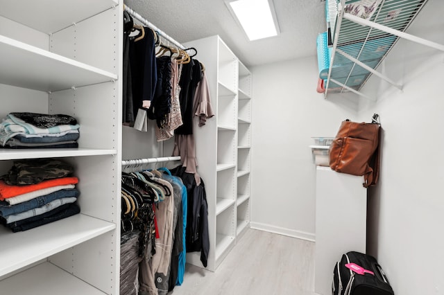 spacious closet with light wood-type flooring