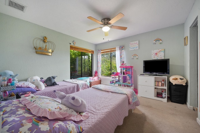 bedroom with light carpet and ceiling fan