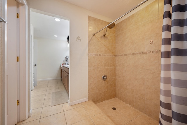 bathroom with vanity, a shower with shower curtain, and tile patterned flooring