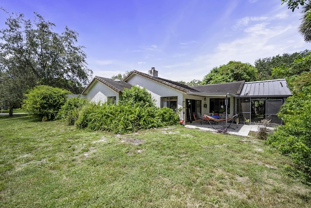 back of house featuring a gazebo, a lawn, and a patio area