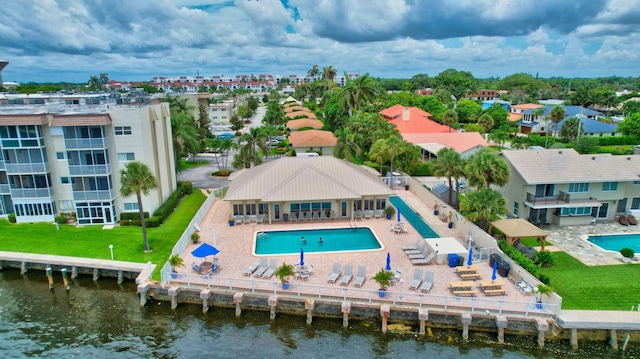 birds eye view of property featuring a water view