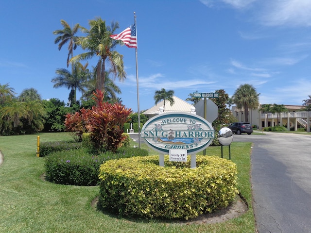 community sign with a lawn