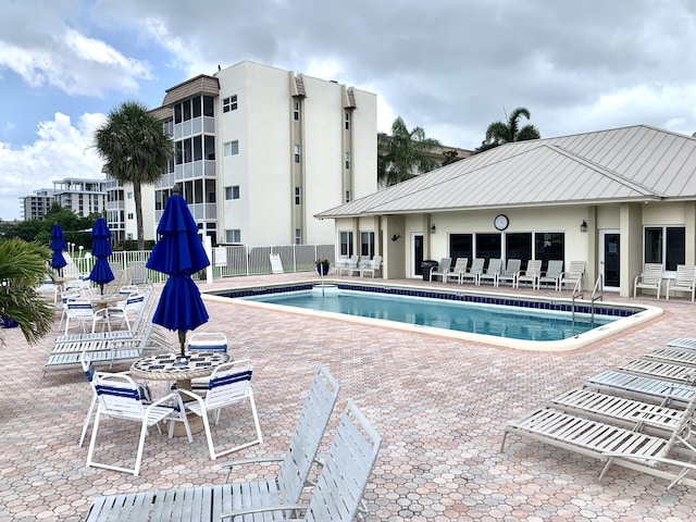 view of swimming pool featuring a patio area