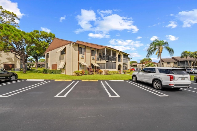 view of car parking featuring a yard