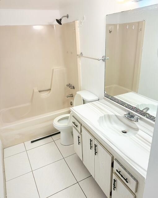 full bathroom with toilet, vanity, shower / tub combination, and tile patterned floors