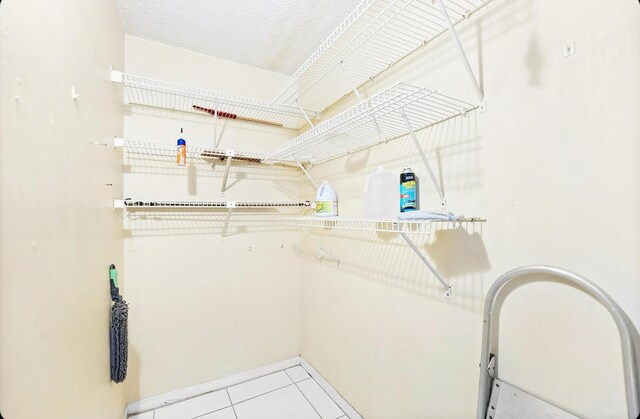 walk in closet featuring light tile patterned floors