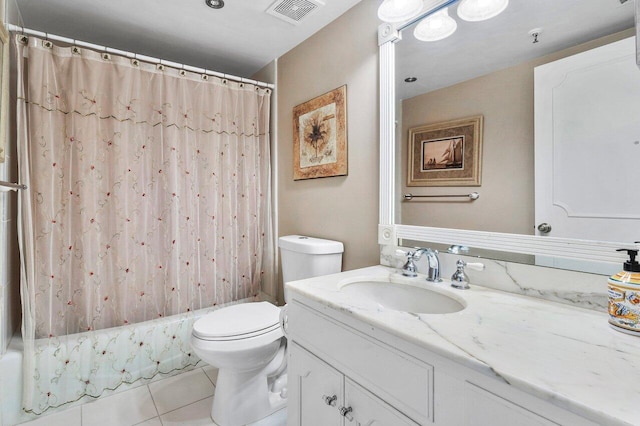 full bathroom with vanity, shower / tub combo with curtain, tile patterned floors, and toilet