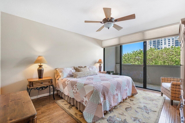 bedroom with ceiling fan, light hardwood / wood-style floors, and access to outside