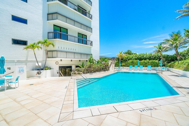 view of swimming pool with a patio