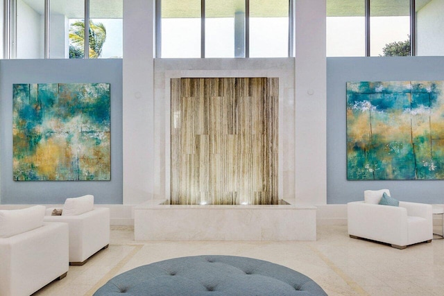 interior space with tile patterned flooring and a towering ceiling