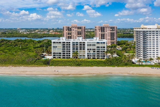 drone / aerial view with a water view and a view of the beach