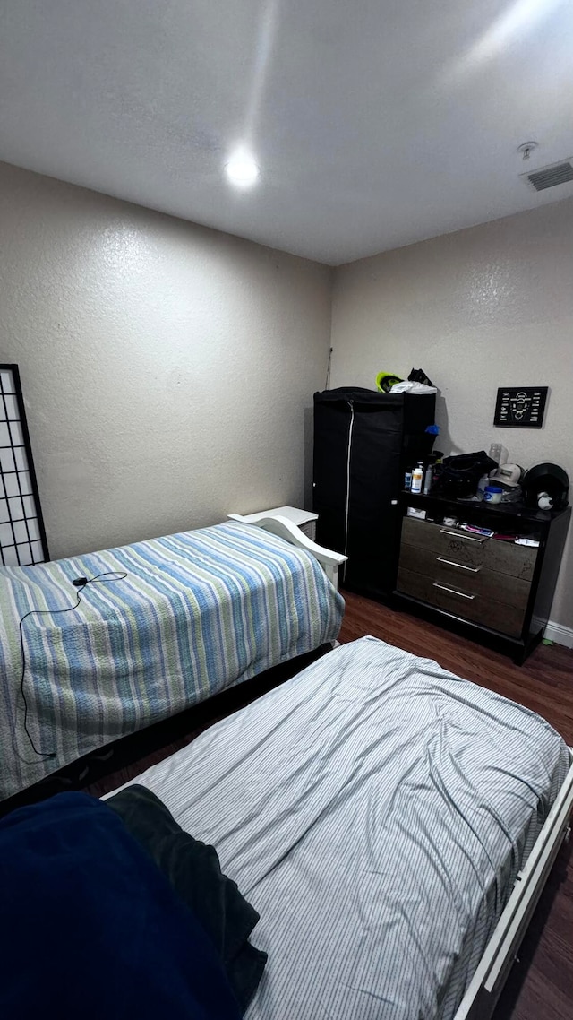 bedroom featuring hardwood / wood-style flooring