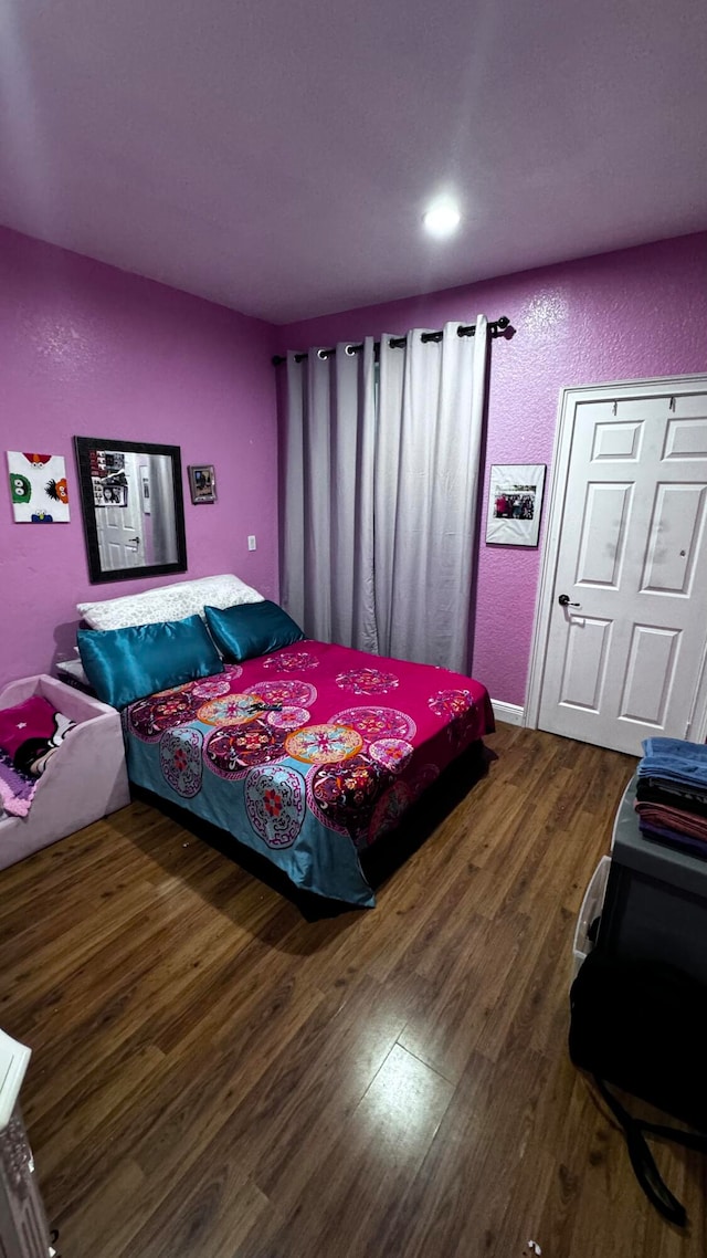 bedroom featuring hardwood / wood-style floors