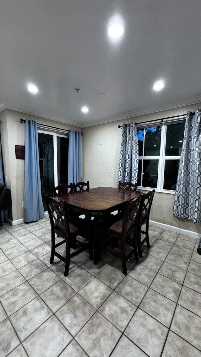 tiled dining space with crown molding