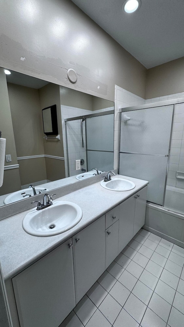 bathroom with dual vanity and tile patterned floors