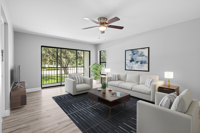 living room featuring hardwood / wood-style flooring and ceiling fan