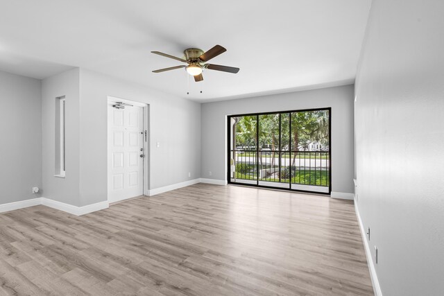 unfurnished room with light hardwood / wood-style floors and ceiling fan