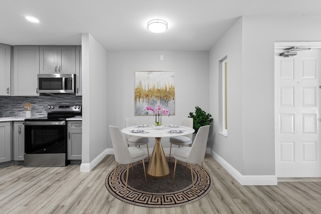 dining room with light hardwood / wood-style floors