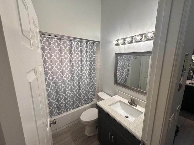 full bathroom with vanity, wood-type flooring, shower / bath combination with curtain, and toilet