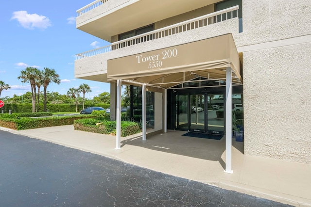 property entrance with a balcony