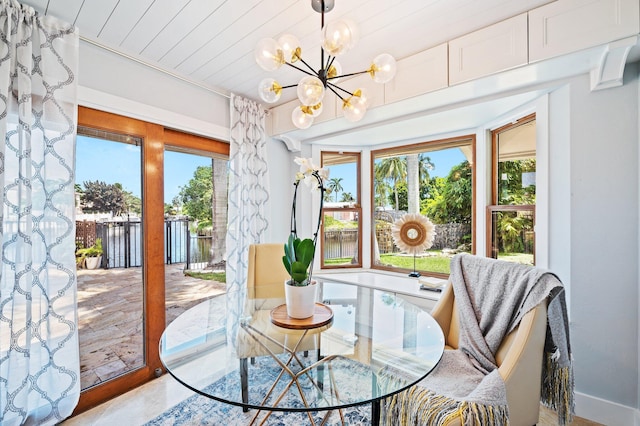 dining space with a notable chandelier and plenty of natural light