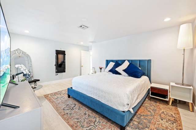 bedroom with light wood-type flooring