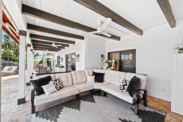 living room featuring beam ceiling, ceiling fan, and tile patterned floors