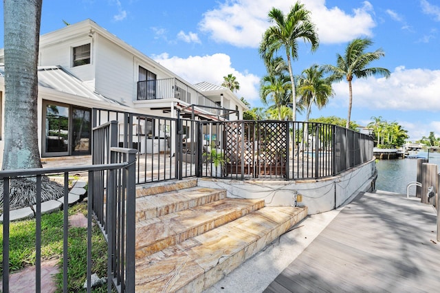 view of gate with a water view