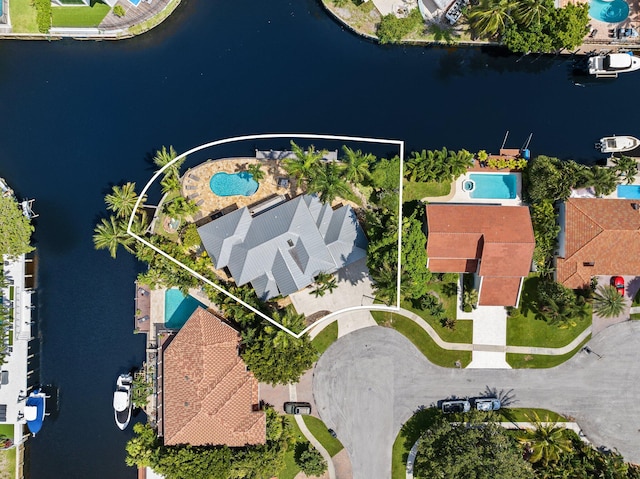 birds eye view of property featuring a water view