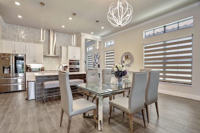 dining room featuring an inviting chandelier and ornamental molding