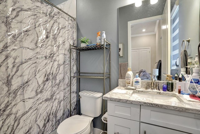 bathroom with walk in shower, ornamental molding, vanity, and toilet