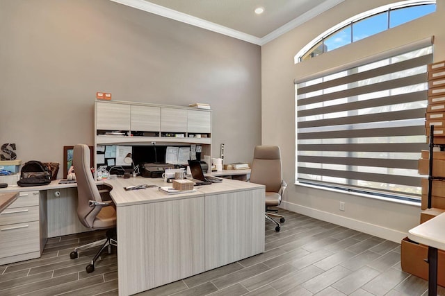 office space featuring a high ceiling and crown molding