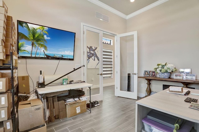 office space with crown molding and french doors