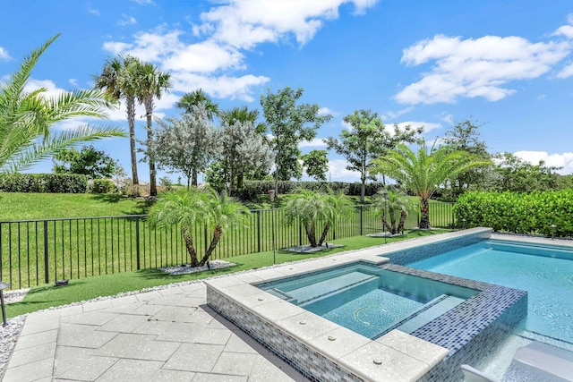 view of pool with an in ground hot tub and a yard