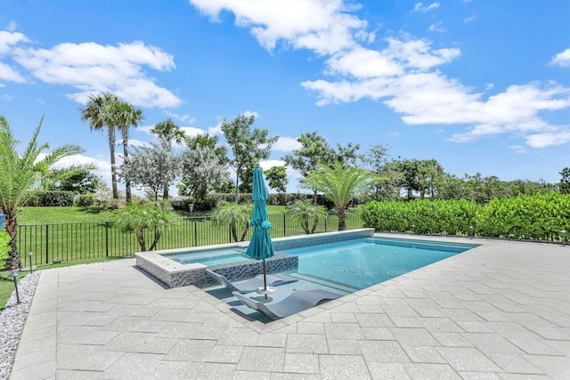 view of swimming pool with a yard and a patio