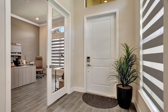 entrance foyer featuring crown molding